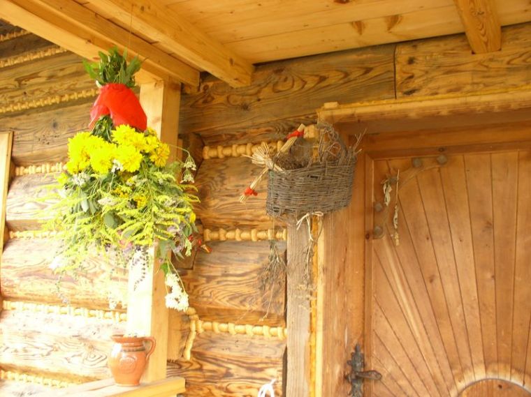 Poland: protective blessed bouquet by an entrance to a renovated cottage